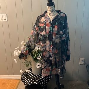 Mid length blouse by Koala Blue. Buttons down the front chiffon.